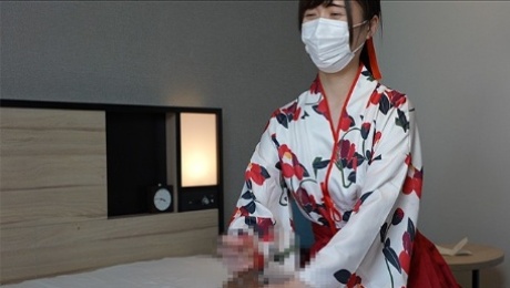 Japanese girl gives a guy a handjob wearing Japanese traditional kimono